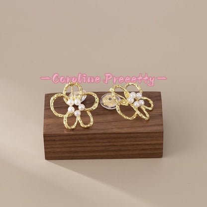 Hollow flower pearl stamen earrings
