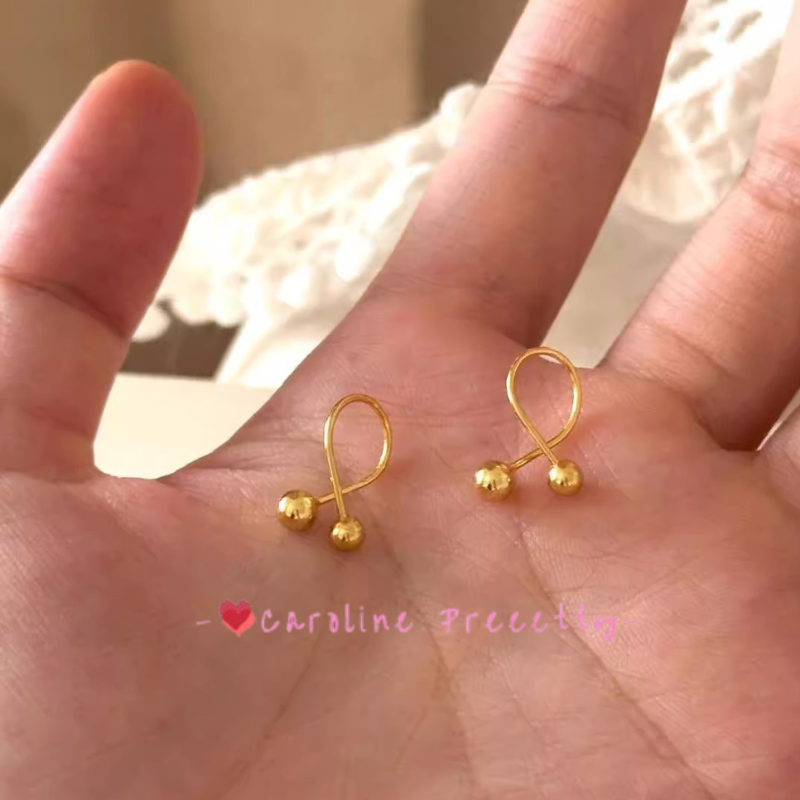 Cross-shaped small golden ball ear studs