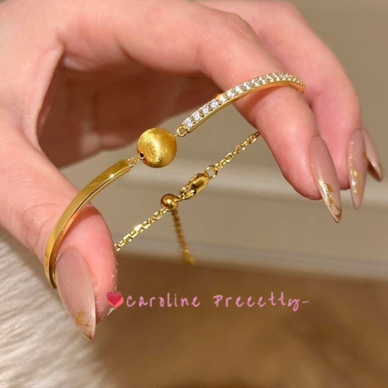 Brushed cat-eye small golden ball and sparkling diamond bracelet