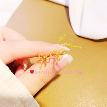 Alloy bow stud earrings