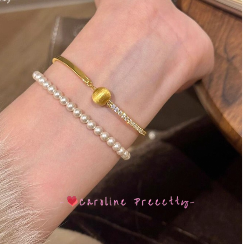 Brushed cat-eye small golden ball and sparkling diamond bracelet