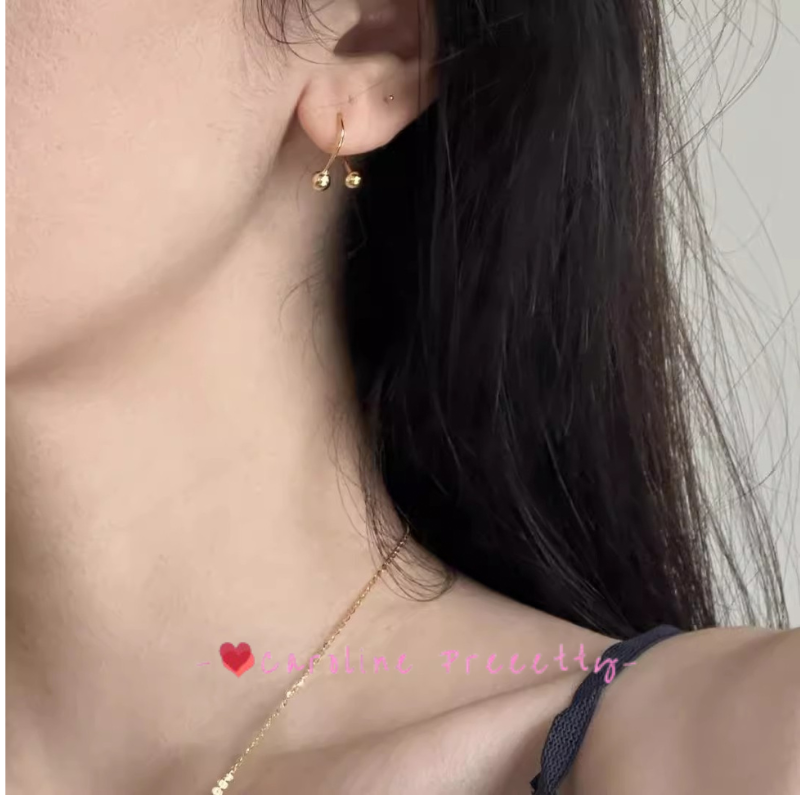 Cross-shaped small golden ball ear studs