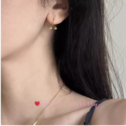 Cross-shaped small golden ball ear studs