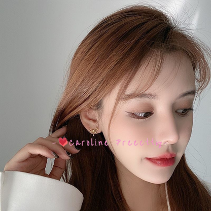 Alloy bow stud earrings