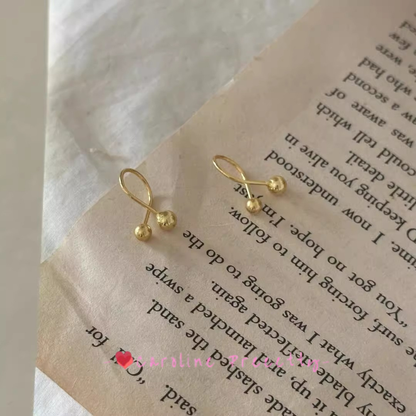 Cross-shaped small golden ball ear studs