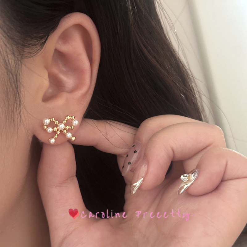 Bow pearl cutout earrings