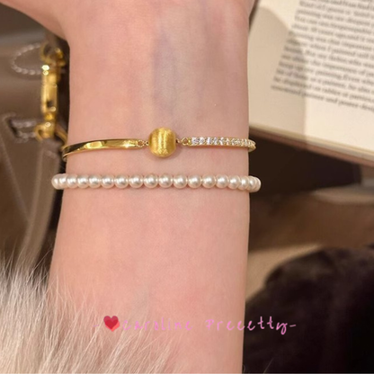 Brushed cat-eye small golden ball and sparkling diamond bracelet