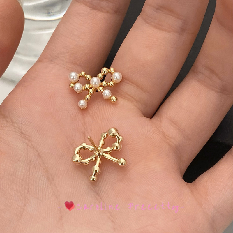 Bow pearl cutout earrings