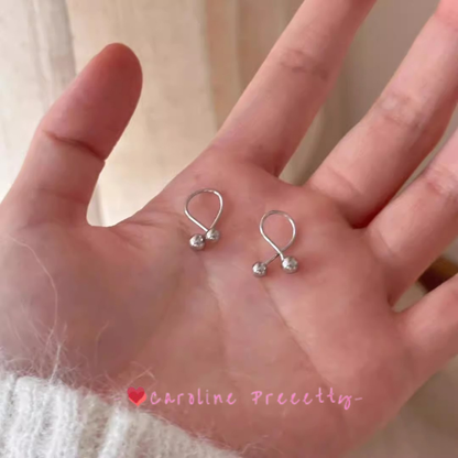 Cross-shaped small golden ball ear studs