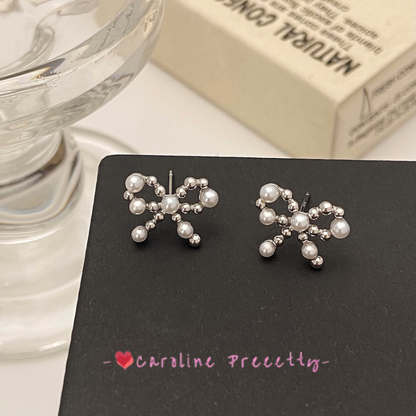 Bow pearl cutout earrings